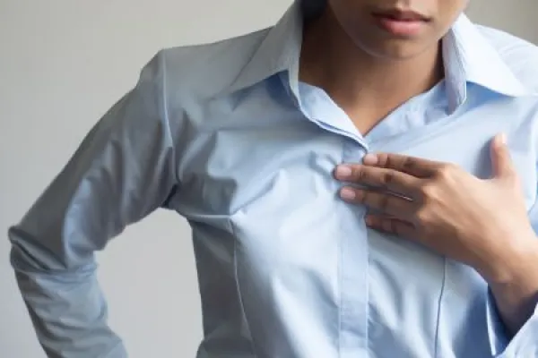 sick woman with indigestion problem, acid reflux or gerd symptoms; woman health care, body care, sickness, pain