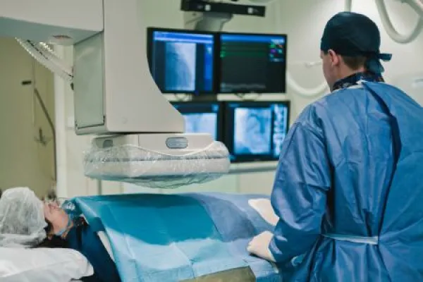 Downloaded Cathlab in modern hospital with doctor, nurse and patient