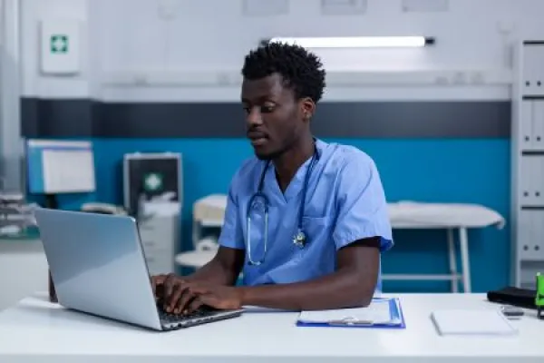 Hospital nurse verifying patient medical records and