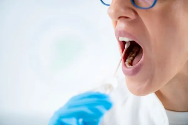 Taking a mouth swab for DNA analysis