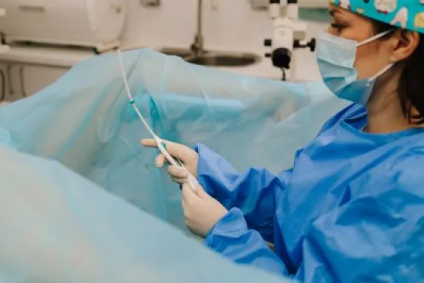 Gynecologist performing IUD insertion.
