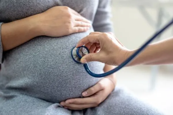 Doctor checking pregnant woman 