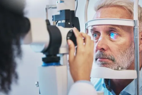 ophthalmologist examining senior patient for glaucoma