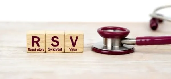 Word Respiratory Syncytial Virus (RSV) on wooden blocks and stethoscope on the wooden table with white background