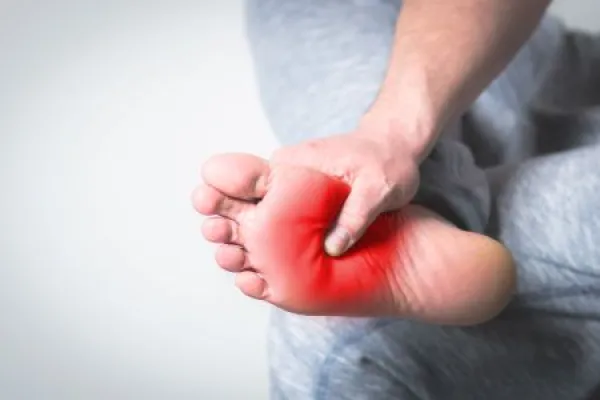 man with pain in foot