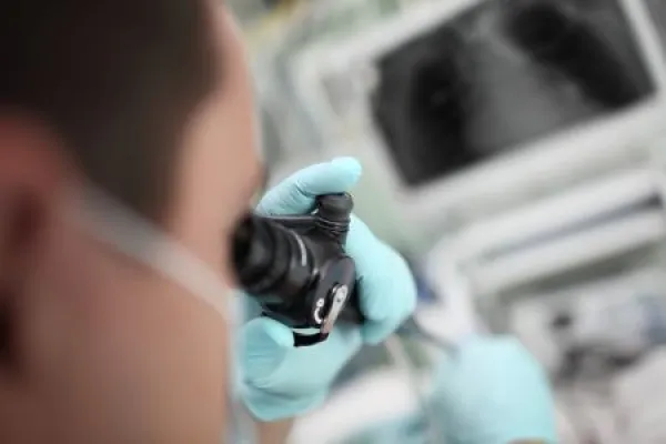 Doctor looking into medical video device