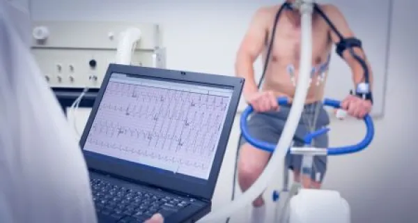 Man doing fitness test on exercise bike