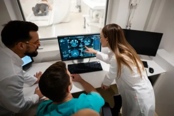 Doctors reviewing patient brain scan for diagnosis