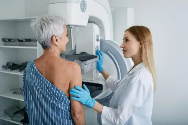 senior patient undergoing screening mammogram