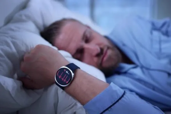 Healthcare Professional Analyzing Patient's Data On Smartwatch
