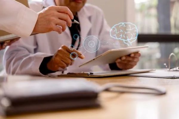 Healthcare professionals using a digital tablet
