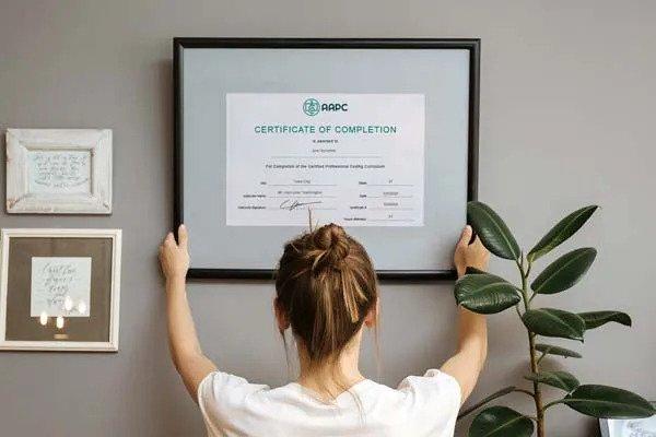 Woman with Framed Certification